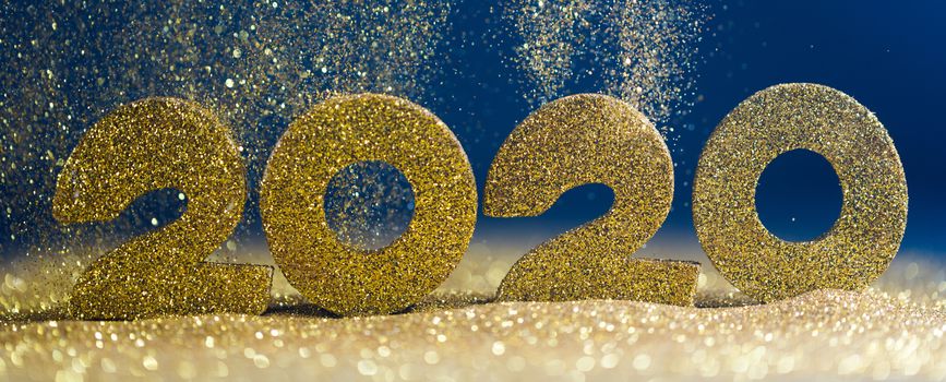 2020 New Year luxury glitter design concept numbers in golden glitters on blue background