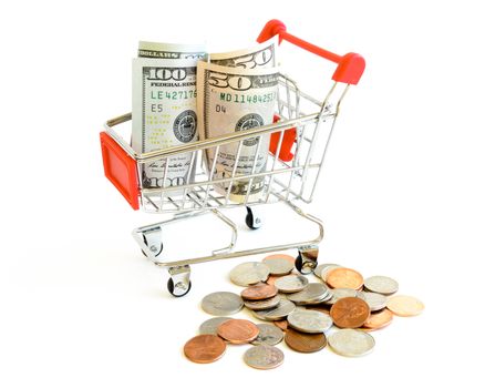 US dollars banknote and coins with shopping cart isolated on white background. Concept of currency, business, finance and online shopping or e-commerce.