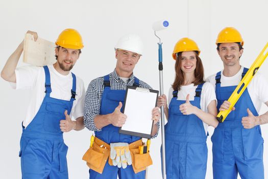 Group of professional industrial workers with tools and contract