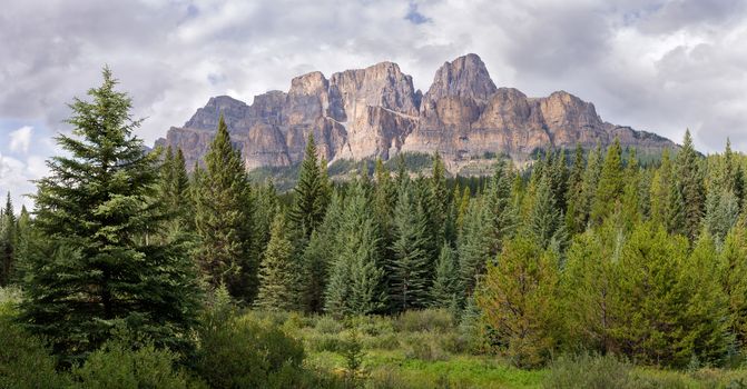 Panoramic image of Castle Mountain under cloudy sky, Bow Valley Parkway, Banff National Park, Alberta, Canada
