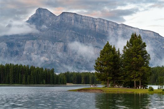 Panoramic image of Mount Rundle and Two Jack Lake with early morning mood, Banff National Park, Alberta, Canada