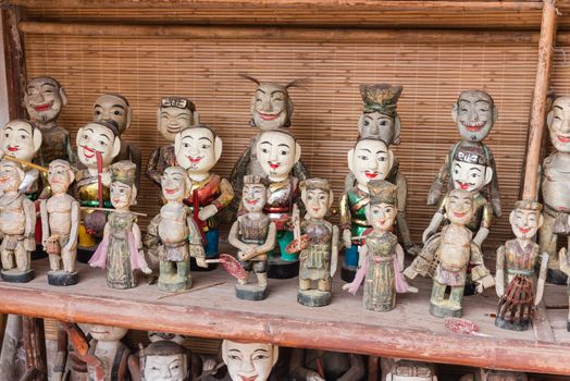 Common Vietnamese water puppets on display for sale as traditional souvenirs in Hanoi. Water puppet is a traditional art of Vietnam. Each represents a character in the life of ancient Vietnamese