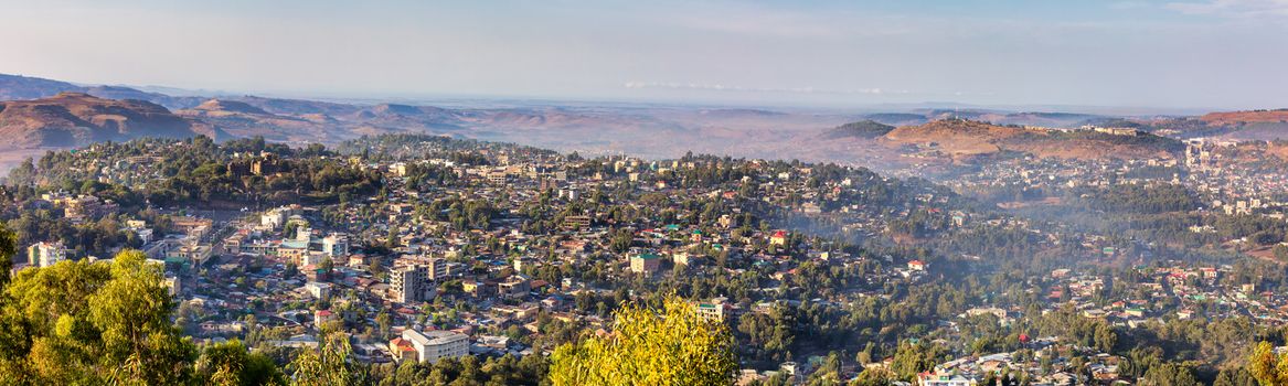 Panorama of city Gondar with Fasil Ghebbi, Royal fortress-city within Gondar, Ethiopia. Imperial palace castle complex is also called Camelot of Africa. UNESCO World Heritage Site.