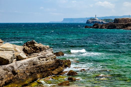 Detail of the clear water of the Camel beach of Santander, Cantabria, Spain. The rocks are like the hump of a Camel.