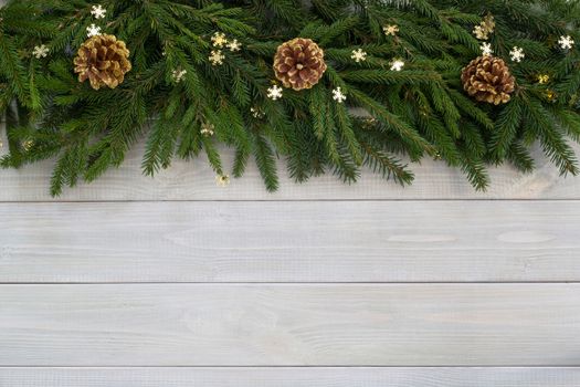 Christmas new year flat lay decor and fir branches on white toned natural wooden plank background texture provence style with copy space for text