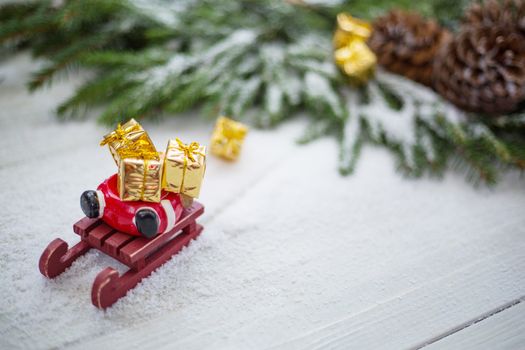 Santa Claus sledge accident in snow with lost gifts around