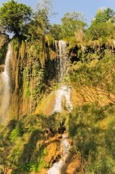 Dai Yem (Pink Blouse) waterfall in Muong Sang Commune, Moc Chau District, Son La Province. Small current fall gushes down its slope with small and medium rocks in various shapes, dazzling white