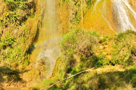 Dai Yem (Pink Blouse) waterfall in Muong Sang Commune, Moc Chau District, Son La Province. Small current fall gushes down its slope with small and medium rocks in various shapes, dazzling white