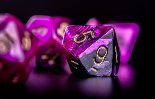 Closeup on set of dice for role playing games, black background