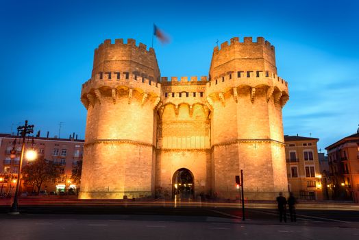 Serrano Towers (Torres de Serranos) at night. Towers are located on Plaza de los Fueros in Valencia, Spain