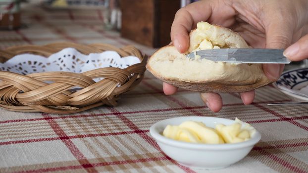 Man eating bread with butter appetizer - people with bread appetizer served before main course concept