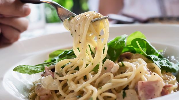 Spaghetti carbonara recipe - famous Italian dish food for background use