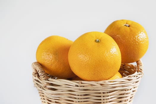 Fresh juicy orange fruit set over white background - tropical orange fruit for background use