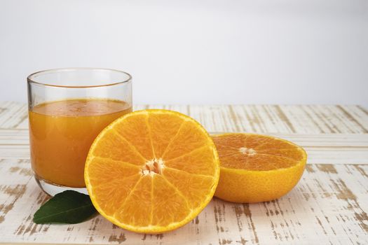 Fresh orange juice fruit drink glass over white background - tropical orange fruit for background use