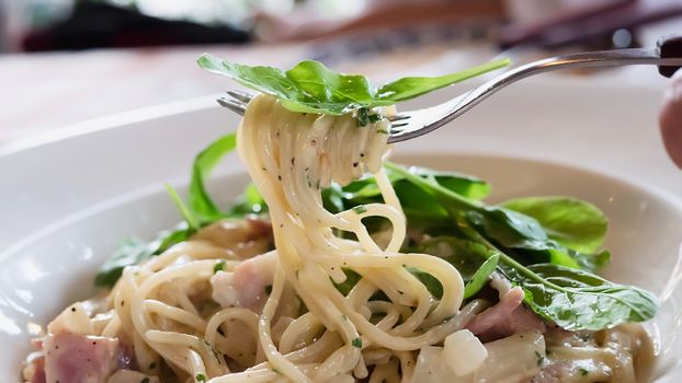 Spaghetti carbonara recipe - famous Italian dish food for background use