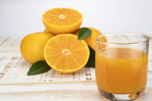 Fresh orange juice fruit drink glass over white background - tropical orange fruit for background use