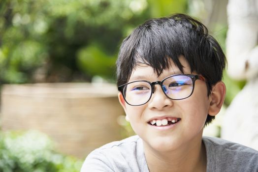 Young Thai boy smiling portrait - happy Asian boy concept