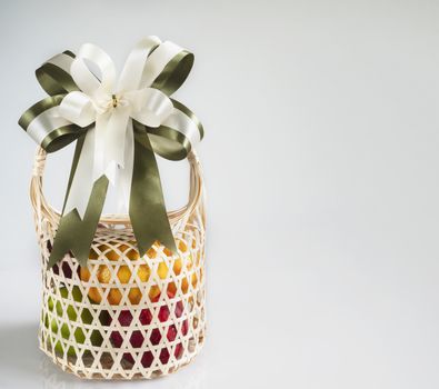 Fresh fruit souvenir in weaved bamboo package over white gray background - fresh fruit gift set for special occasion concept