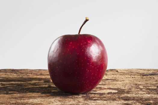 Fresh colorful apple over gray background - clean fresh fruit background concept