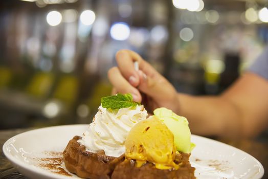People eating ice cream scoop with waffle on white plate - people with fresh relax sweet ice cream concept