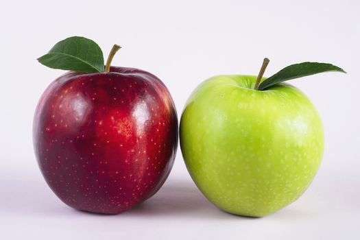 Fresh colorful apple over gray background - clean fresh fruit background concept