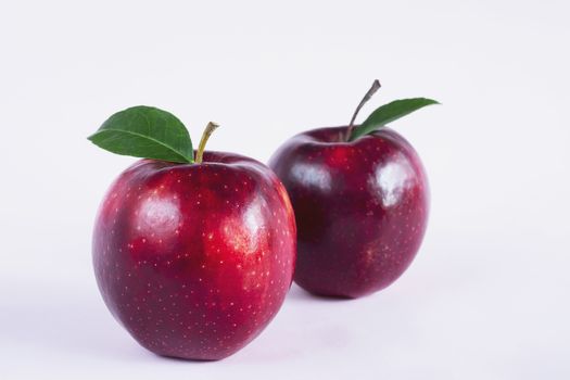 Fresh colorful apple over gray background - clean fresh fruit background concept