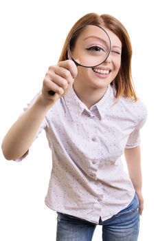 Close up portrait of a cheerful pretty young woman looking at camera through magnifying glass, isolated on white background.
