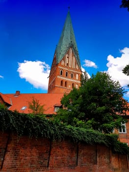 Lüneburg, Germany, Dom and old historic houses with blue sky and clouds in the background