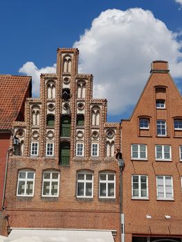 Half-timbered red brick houses near the river on the old harbor Lueneburg, Germany