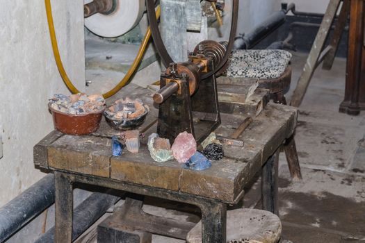 Old workbench with various tools and machines.