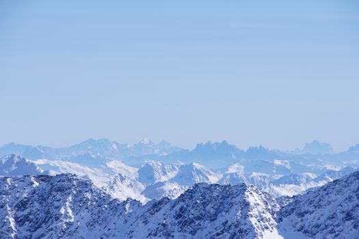 Range of winter mountain peaks at sunny day at Soelden Austria