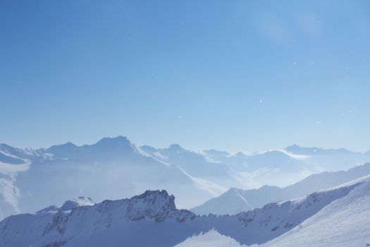 Range of winter mountain peaks at sunny day at Soelden Austria