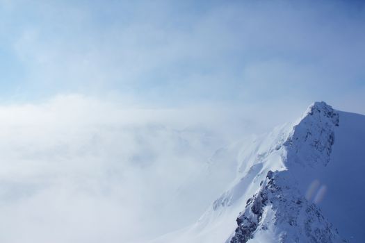 Range of winter mountain peaks at sunny day at Soelden Austria