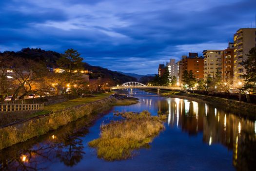 Evening reflections on Asanogawa river, Kanazawa, Japan.