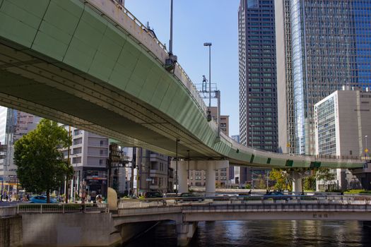 An elevated expressway winding through Osaka, Japan.