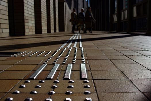 Tactile paving outside a large building in Osaka.