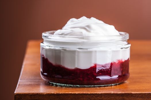 Plain greek yogurt over a delicious raspberry compote as healthy food