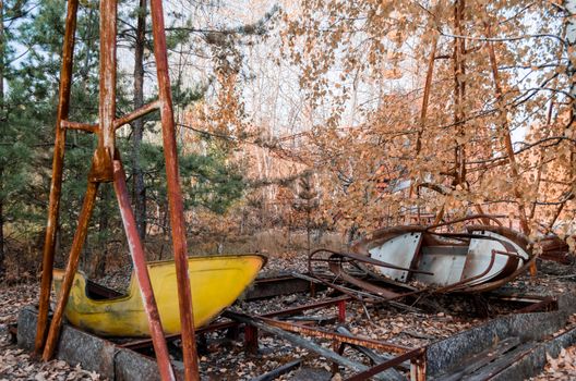 boat in an abandoned amusement park in Chernobyl Ukraine in autumn