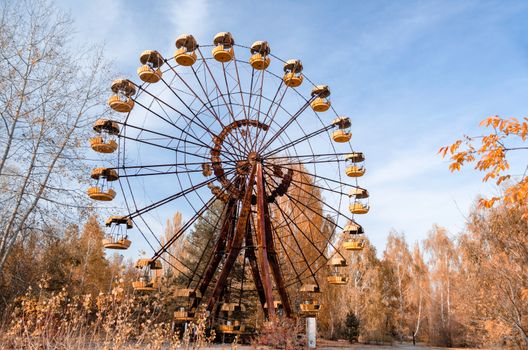 old carousel wheel in an abandoned amusement park in Chernobyl Ukraine in autumn
