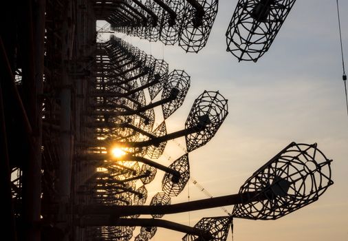 secret army antenna locator in the forest at sunset with sun rays in Chernobyl Ukraine in autumn