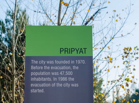 memorial on the background of trees and blue sky in Chernobyl Ukraine