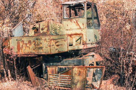 abandoned broken equipment car in the Chernobyl forest Ukraine in autumn