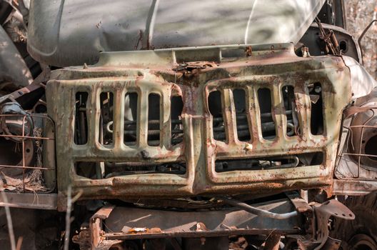 fragment radiator abandoned rusty army truck in the forest in Chernobyl Ukraine