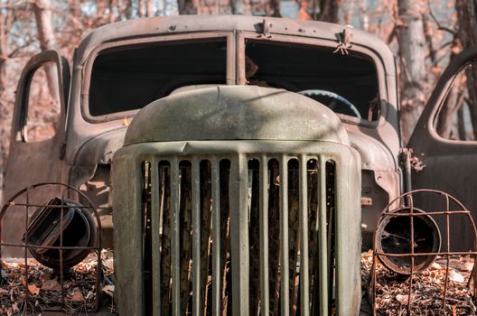 cabin of a rusty military army truck in the Chernobyl forest Ukraine close up