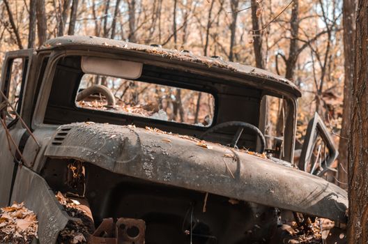 old broken army truck in the Chernobyl forest Ukraine close up