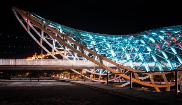 background no people modern bridge with neon light at night Tbilisi in Georgia