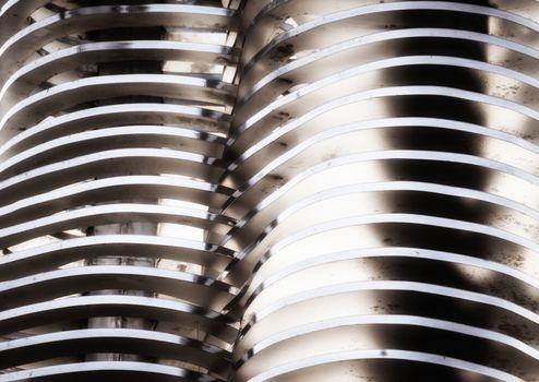 abstract background smooth curved lines metal construction close up
