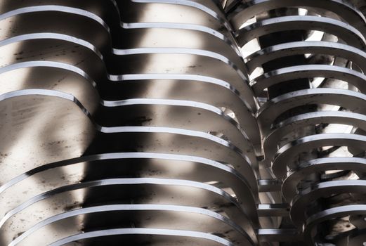 abstract background smooth curved lines metal construction close up