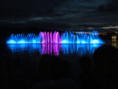 
Night photo of fountains of different colors.