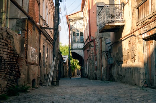 old town street houses with balconies in Georgia in autumn afternoon